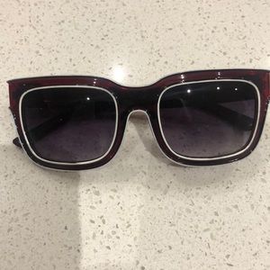 Maroon sunglasses with white trim A.J. Morgan